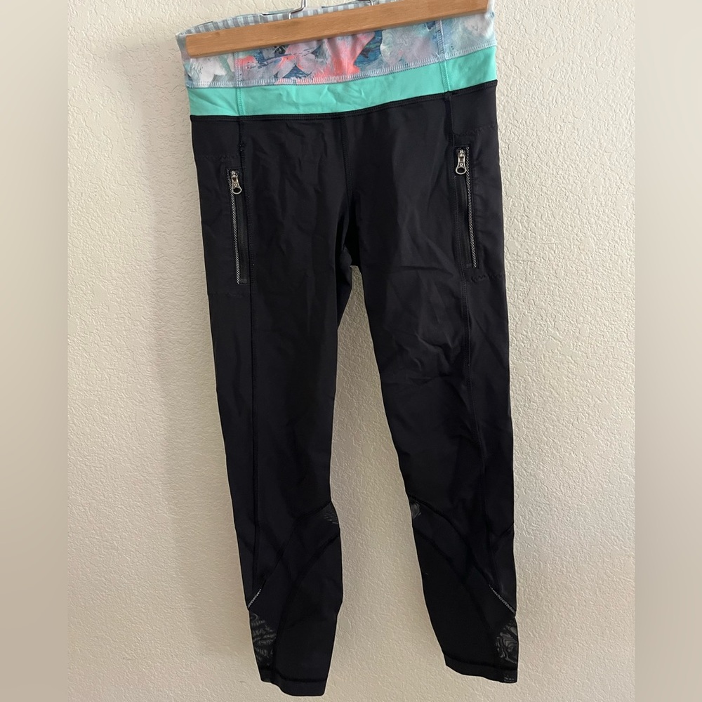 Lululemon black leggings size 4 with 23” inseam and zipper pockets